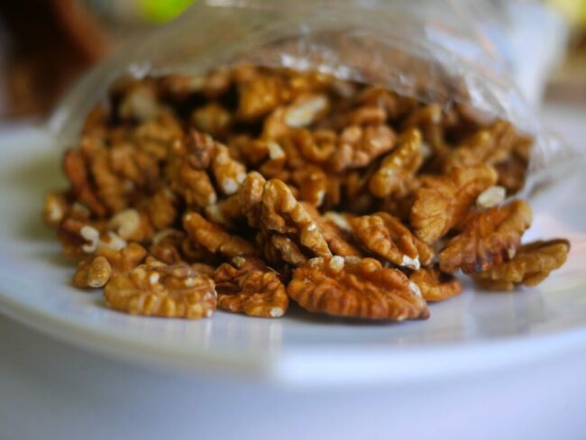 brown peanuts on clear plastic container