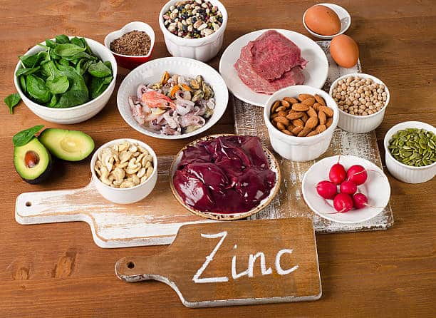 Foods with Zinc mineral on a wooden table. Top view