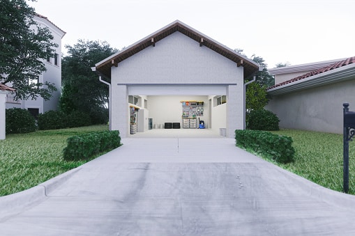 Open door of a modern garage with a concrete driveway at the urban district.