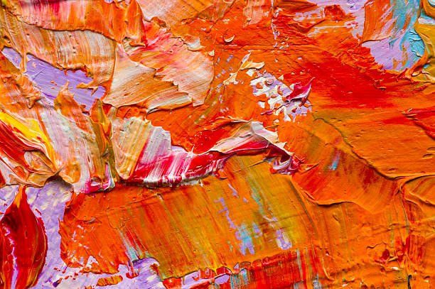 Artist's palette with mixed oil paints, macro, colorful stroke texture on canvas, studio shot, abstract art background